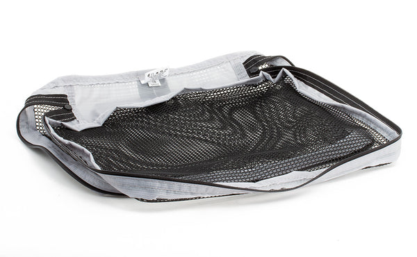 An empty, open Medium Tri-Star Packing Cube in Northwest Sky (light grey) 120 Aether.